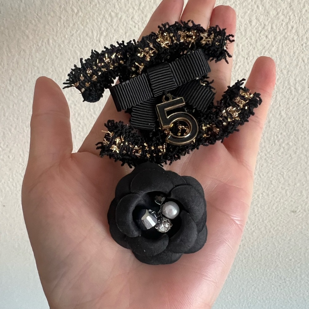 Black camellia pin set brand new